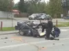 Police officers investigate a demolished car that was destroyed
in a high-speed crash in downtown Wasilla Monday morning. (Photo
courtesy of Scott Riley)
