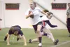 Wasilla's Kayla Bell breaks past two Houston defenders during
Monday's flag football game at the Curtis D. Menard Memorial Sports
Center in Wasilla. (ROBERT DeBERRY/Frontiersman)