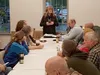 Claudia Dolfi of Sutton, standing, moderated a Tuesday evening community council meeting to discuss security concerns over Chickaloon peace officer Matt Schwier and his recent arrest on child