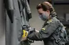 U.S. Air Force Capt. Kate “Flare” Archer, F-22 Pilot with the 27th Fighter Squadron, prepares her gear before stepping out to the flight line, on Joint Base Langley-Eustis, Virginia, Feb. 25,