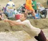 ROBERT DeBERRY/Frontiersman Darren Wiebe of the Faith Bible
Fellowship Mud Flaps team makes a diving save during early round
competition of the mud volleyball games Saturday in Big Lake.