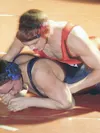 Wasilla's Cory Crane muscles his opponent, Soldonta's T.J.
Stone, during the championship match of the 152-pound weight class.
Crane pinned Stone in the second period. JEREMIAH BARTZ/
Frontie