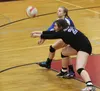 Palmer's Kennedy Bryan reaches to receive a serve during a 3-1 win over Soldotna on the first day of tthe Northern Lights Conference Championships at Wasilla High School. Jeremiah Bartz/Front