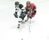 ROBERT DeBERRY/Frontiersman Wasilla senior Jade Johnston, right,
battles for the puck during a win over Colony in late January.
Since dropping a 3-0 decision to East Anchorage on Jan. 15, the
