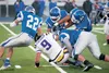 A pack of Moose take down Lathrop quarterback Robert Tanner during Friday’s game at Machetanz Field in Palmer. The Moose defeated the Malemutes 42-19, and improved to 2-0 in Railbelt Conferen