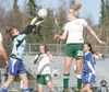 ROBERT DeBERRY/Frontiersman Palmer goalkeeper Chelsea Riley
blocks a header from Colony’s Kara Larson during the Knights 2-1
win Friday at Colony high School.