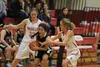 Wasilla sophomore McKenna Dinkel and senior Machia Toews try to take the ball away from a Thunder Mountain player during a loss to the Falcons earlier this season. JEREMIAH BARTZ/Frontiersman