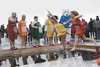 Mat Su Health Services 2014 Mat-Su Plunge team jumps into an icy Wasilla Lake Saturday dressed as Taco Bell hot sauce packets. HEATHER A. RESZ/Frontiersman.com