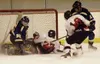 Houston's Jimmy Estes slides into the net after attempting to
score a goal in the first period of Thursday's game against
Tri-Valley. Although Estes made it into the net, the puck did not.
Ph