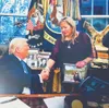 Sandy Snodgrass, right, shakes the hand of President Donald Trump at the White House. Courtesy photo