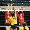 Wasilla hitters Olivia Vincent and Brooke Queripel reach for the block during a 3-2 win over Kodiak on the second day of the ASAA/First National Bank 4A State Volleyball Championships, Nov. 1