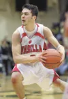 Former Wasilla High standout Jesse Bean, above, moves the ball
down the floor during his senior year. Bean helped lead Wasilla to
the 2007 4A state title as a senior. ROBERT DEBERRY/Frontiers