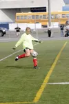 MATT TUNSETH/Frontiersman Wasilla goalkeeper Sammy Becker boots
the ball against Juneau-Douglas during the Crimson Bears’ 2-0 win
over Wasilla in the first round of the ASAA/First National Ba