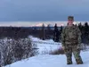 Air Force Senior Airman Alaina Armentrout poses for the camera with Denali in the background, January 30, 2020 at Joint Base Elmendorf-Richardson, Alaska. Armentrout is assigned to the 381st 