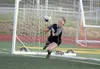 Wasilla goalkeeper Aleks Kvalheim reaches to make a save during a shootout win over West Anchorage during the Division I girls' state semifinals Friday, May 25, 2018, at Service High in Ancho