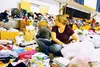 Kendra Peppard sorts baby clothes for the Community Clothing Giveaway in 2014 at this year’s new, additional location, Wasilla Lake Church of the Nazarene. This year’s giveaway is from 9 a.m.