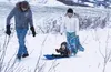 One-year-old Savaty Basargin enjoys his first sledding excursion with parents Iona Basargin and Revecca Kuznetsov at the top of the "16 Mile" trail in Hatcher Pass. To experience more winter 