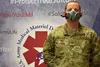 U.S. Air Force Maj. Daniel Williams demonstrates the fit of an N95 elastomeric half-mask respirator. Williams serves as product manager of the Warfighter Expeditionary Medicine and Treatment 