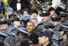 Colony grad sits near president