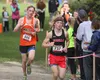 Wasilla sophomore Hunter Hayes rounds a corner during the second lap of the varsity boys race during the Palmer Invitational Saturday, Sept. 2, 2017, at Palmer High School. Hayes led all Vall