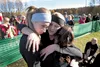 Members of the Wasilla Wariors girls cross country team hug after finishing the 5K race at the ASAA/First National 4A Cross Country Running Championships Saturday at Bartlett High School. ROB