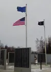 Members of the VFW Post 9365 and local JROTC raised the flags of the United States, the State of Alaska, and the POW/MIA during a ceremony at the Veterans' Wall of Honor, in honor of Veteran'