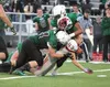 Wasilla’s Matthew Thomas loses his helmet as Colony’s Antonio Bush and Fischer Summers get the tackle during Wasilla’s 35-26 win over the Knights Friday at Colony High School. ROBERT DeBERRY/
