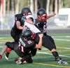 Houston's Noah Griffeth (21), Tanner Barclay (44) and Arrin Paul (62) make a tackle during a 36-6 win over Valdez Aug. 29 in Houston. For more photos from the game, see matsusports.net. Court