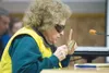 Lois Wier uses a magnifying glass to check her notes while
speaking at the Wasilla City Council meeting Monday evening. Wier
spoke about her unhappiness with the way the Wasilla Senior Center