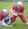 Wasilla junior Braydon Kuiper tries to stretch forward during a
loss to North Pole two weeks ago. Kuiper will line up at wide
receiver against Lathrop, giving the Warriors three receivers in
