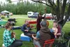 Andy Ferguson (middle), Jeff Snedgen with his daughter Duna (right), Kari Hendrich (left), Caroline Oakley (middle left), and Chris Behnke (middle right) play Ferguson’s original song togethe