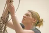 ROBERT DeBERRY/Frontiersman Cheri Ables works on a willow branch
during a “Weaving Living Willows” seminar at the 2010 Spring Garden
Symposium on Saturday at Houston Middle School.