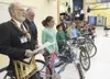 John 'Bo' Cline, left, secretary of the local Masonic Lodge,
announces the fifth grade boys winner of a new bike at Sherrod
Elementary Monday afternoon. (ROBERT DeBERRY/Frontiersman)