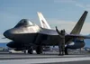 U.S. Air Force Staff Sgt. Christopher Graham, 3rd Wing crew chief, marshalls an F-22 Raptor on the flight line at Joint Base Elmendorf-Richardson, Alaska, during an elephant walk, May 5, 2020