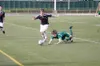 Juneau’s Kevin Gullufsen, left, gets past a diving Bridger Van
Ness during the Crimson Bears’ 3-1 win over Colony in the first
round of the ASAA/First National Bank State Soccer Championships