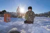 Tyler Mattison, 7, watches his line for a bite Saturday morning
during the Gettin' Jiggy With It Ice Fishing Derby on Knik Lake.
(ROBERT DeBERRY/Frontiersman) Robert DeBerry