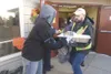 Ryan Robson, right, gets a frozen turkey from volunteer Ruth
Pearcy at the 2010 Valley Thanksgiving Blessing at Good Shepherd
Lutheran Church. (ROBERT DeBERRY/Frontiersman file photo)