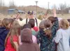 Photo courtesy Victoria Naegele Bob Shumaker, farmer and Mat-Su
Borough School District employee, talks to Sherrod students about
raising pigs as part of Alaska Ag Day events at the Palmer
el