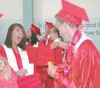 Left: Khori Elder lets loose with a happy scream at classmate
Tillerman Kroon as the Wasilla High School Class of 2009 prepared
for graduation Thursday. About 240 graduates walked the stage a