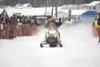 ROBERT DeBERRY/Frontiersman The team of Nick Olstad and Todd
Minnick leave the starting chute Sunday on Big Lake during the
start of the 2011 Iron Dog snowmachine race. Minnick and Olstad
wer