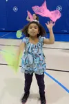 Goose Bay Elementary School student Kanesh Prater concentrates while juggling scarves. Courtesy Nancy Blake