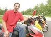 ROBERT DeBERRY/Frontiersman Alaska Scooter owner Joe Schroeder
hopes to see more Valley residents combat the increase in gas
prices with the purchase of a scooter from Alaska Scooter