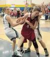 ERIK WANDER/For the Frontiersman Colony senior Allie Grazulis,
left, tries to rip the ball away from Wasilla sophomore Kelsey
Cottle during the Knights’ 50-46 win in the Northern Lights
Confe