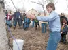 Julie Cascio of the University of Alaska Fairbanks Cooperative Extension Service talks about tapping a tree during a birch tree tapping class Saturday at the Palmer Center for Sustainable Liv
