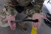 Air Force Airman 1srt Class Andrew Mathews, 3rd Aircraft Maintenance Squadron weapons load crew member, use a spanner wrench to lock an LAU-142/A Advanced Medium-Range Air-to-Air Missile Vert
