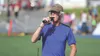 Mike Janecek announces names of runners making the dash down the final stretch of a race during the Palmer Invitational Saturday, Sept. 3, 2016, at Palmer High School. More than 1,000 athlete