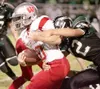 Wasilla senior Chris Bydlon breaks past the Colony defensive
line during Friday’s game at Colony High School. ROBERT
DeBERRY/Frontiersman