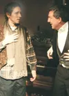 J.J. HARRIER/ Frontiersman Bob Cratchit (Scott Alred), left, is
overwhelmed by Scrooge’s (A.J. Seims) generosity and Christmas
cheer in a scene from ‘A Christmas Carol’ at Teeland’s Mercantil