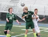 Colony High's Jake Forstner knocks a header into the air as Austin Richardson looks on during Colony's 4-1 win over Kenai Central in the Northern Lights Conference boys title match last week 