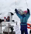 Sophia Burke waves sprinklers in the air during the Iditarod restart. Jacob Mann/Frontiersman